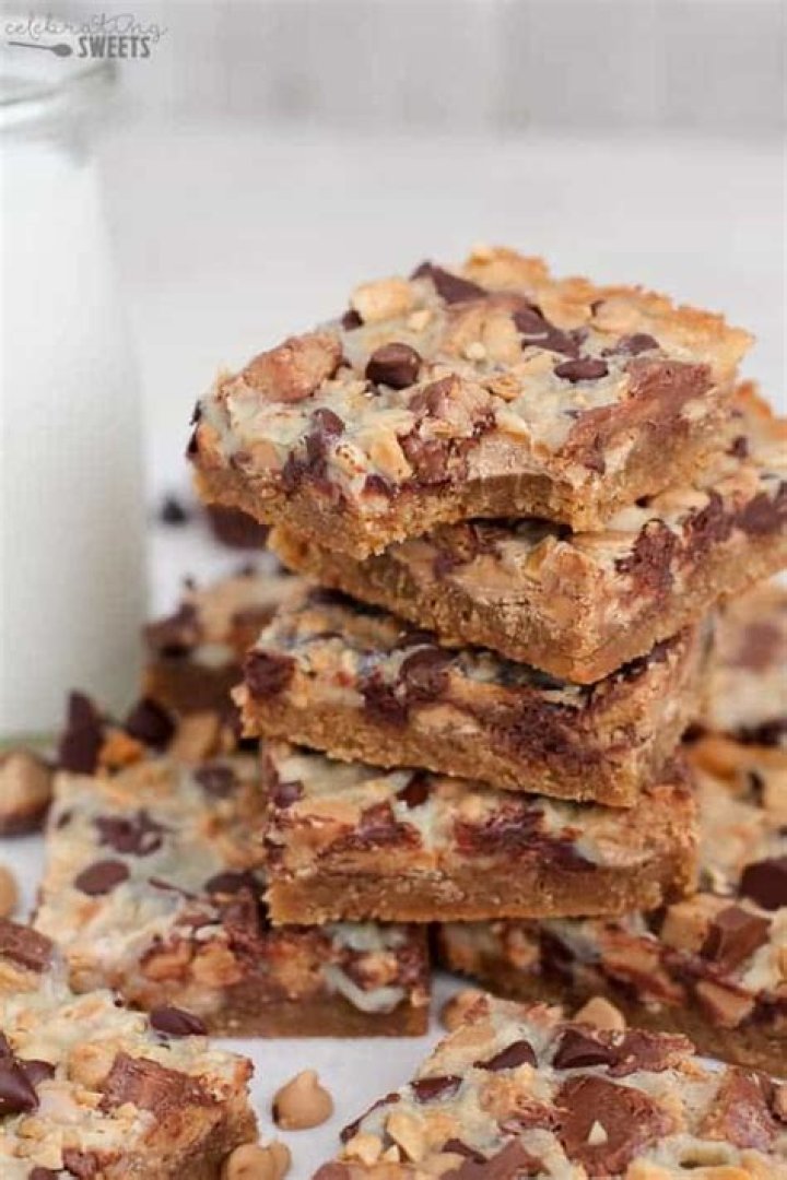 Magic Cookie Bars filled with Peanut Butter Cups and Chocolate